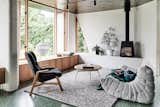 Living, Chair, Rug, Terrazzo, Wood Burning, Coffee Tables, Sofa, Floor, and Bench The addition now forms a comfortable and fully functional new social heart for the home.  Living Bench Terrazzo Chair Photos from A Melbourne Home Gains a Gorgeous Glass-Fronted Addition