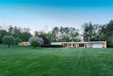 Exterior, Wood Siding Material, House Building Type, Flat RoofLine, Brick Siding Material, Mid-Century Building Type, and Glass Siding Material The property has a sleek, low profile.  Photo 10 of 10 in Own a Sleek Midcentury Abode by Iconic Architect Eliot Noyes For $2.75M
