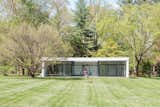 The detached guesthouse is reminiscent of Philip Johnson's iconic Glass House.