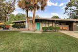 Exterior, Mid-Century Building Type, Brick Siding Material, Glass Siding Material, House Building Type, and Wood Siding Material The stylish midcentury has an elegant profile. 

  Photo 1 of 21 in A Carefully Restored Midcentury Hits the Market at $415K in Savannah, Georgia