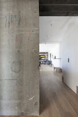 Hallway and Light Hardwood Floor Colorful writing from the original construction over 50 years ago.

  Photo 8 of 18 in An Iconic T-Shaped Apartment Receives a Modern Makeover