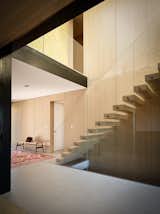 A grand staircase was transformed into a floating cantilevered structure, bringing natural light into the lower rooms.