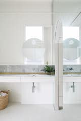 Bath, Porcelain Tile, Marble, Undermount, Wall, and Marble Even the bathrooms have a luminous feel.  Bath Porcelain Tile Marble Photos from An Australian Cottage Gets a Mediterranean-Inspired Revamp