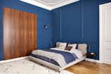 Bright and bold choices continue with the master bedroom. The walls have been painted a rich blue T0.30.20 from Sikkens.&nbsp;