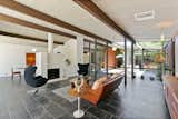 Living, Wood Burning, Porcelain Tile, Sofa, Coffee Tables, End Tables, Pendant, Chair, and Rug The expansive open-plan living area is also bright and airy. 

  Living Porcelain Tile End Tables Pendant Chair Photos from A Bright and Breezy Eichler Hits the Market at $1.45M in California