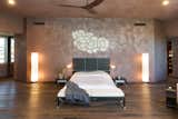Bedroom, Night Stands, Recessed Lighting, Floor Lighting, Dark Hardwood Floor, Bed, and Wall Lighting The upper level is devoted to the oversized master suite.

  Photos from Wilt Chamberlain's Former Bel Air Bachelor Pad Is Listed For $18.9M