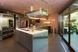 Kitchen, Refrigerator, Recessed Lighting, Range Hood, Cooktops, Pendant Lighting, and Colorful Cabinet A look at the stainless-steel chef's kitchen and breakfast room.

  Photo 9 of 11 in Wilt Chamberlain's Former Bel Air Bachelor Pad Is Listed For $18.9M