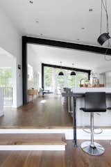 White interiors and ample glazing now make the space feel open and bright up. Blackened beams pick up on the industrial aesthetic of the exterior.

