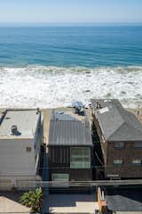 Exterior, Metal Siding Material, Gable RoofLine, Metal Roof Material, Beach House Building Type, and House Building Type LOHA’s design is a result of new code requirements and creatively working within limitations so that the project would successfully maximize the site potential. 

  Photo 3 of 12 in Own This Sustainably Designed Malibu Beach House For $5.7M