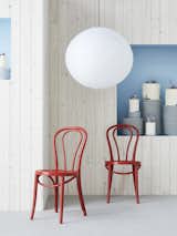 Living Room, Pendant Lighting, and Chair The BJURÅN chair, formerly known as ÖGLA, is still manufactured by the same factory in Poland with the solid wood bent in the same artisanal way.  Photo 10 of 12 in Take a Peek at How IKEA Is Celebrating its 75th Birthday