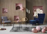 Living Room, Chair, Coffee Tables, Rug Floor, End Tables, and Floor Lighting The designs from the 1950s-60s capture the midcentury period, embracing classic lines and darker woods.

  Photo 1 of 12 in Take a Peek at How IKEA Is Celebrating its 75th Birthday