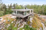 Exterior, House Building Type, Flat RoofLine, Beach House Building Type, and Wood Siding Material  Photo 1 of 16 in Picture Yourself  in This Clifftop Swedish Retreat Asking $1.08M