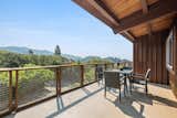 Outdoor, Trees, Large Patio, Porch, Deck, and Side Yard The view from the upper wraparound deck.  Photo 14 of 14 in A Dreamy Midcentury in Oakland Is Seeking a New Owner For $1.4M