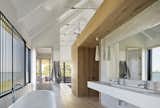 The wood also helps define the bathroom and add a sense of privacy in the space, which has largely been left open.&nbsp;