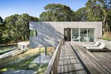 Outdoor, Shrubs, Rooftop, Large, Trees, Grass, and Horizontal The roof deck forms a connector between the two cedar-clad volumes, while also providing additional outdoor space.   Outdoor Grass Trees Rooftop Photos from A Gorgeous Refuge Treads Lightly on its Surrounding Nature Reserve