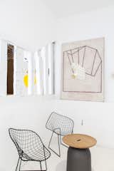 Bertoia Diamond Lounge Chairs work perfectly with the rotating collection of art.&nbsp;