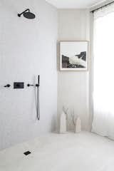 Bath Room, Open Shower, Concrete Wall, and Concrete Floor Even the terrazzo and concrete black-accented bathroom is a stunning showcase for the collection.  The shower has been left open since it will not be used. 

  Photos from A Parisian Townhouse Is Reborn as a Luminous Art Gallery