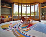 Living Room, Sofa, Table, Chair, and Rug Floor The design also features inward views onto a central courtyard with a plunge pool and shaded garden.  Photo 5 of 13 in The Iconic Home Frank Lloyd Wright Built For His Son Is Listed For $13M