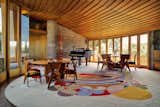 Living Room, Sofa, Table, Rug Floor, and Chair The living space features the "March Balloons" carpet designed by Wright.  Photo 3 of 13 in The Iconic Home Frank Lloyd Wright Built For His Son Is Listed For $13M