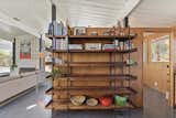 A&nbsp;bookshelf divider separates the kitchen from the dining room, while also adding storage.&nbsp;