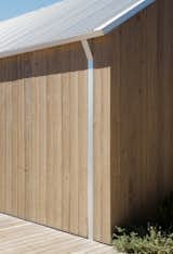 The attention to detail extends to the design of the home's streamlined contemporary gutters.