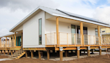 Five solar panels line the roof.  Photo 13 of 21 in Here Are the Modern Prefab Designs That Amazon’s Investing In