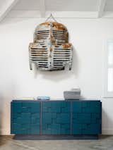 Bedroom, Dresser, and Concrete Floor A vintage car grill serves as a found art installation.  Search “stem dresser” from A Delicate Renovation Revives a ’70s Beach House in Northern California