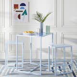 Dining Room, Table, Chair, and Rug Floor The three-piece metal and glass Valley Bistro set is perfect for a small kitchen or nook. 

  Photo 7 of 8 in Take a Peek at Amazon's  Colorful Collaboration With Iconic Designer Jonathan Adler