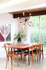 Dining Room, Chair, Concrete Floor, Table, and Pendant Lighting A look at the dining area.  Photo 5 of 19 in An Updated Eichler With an Indoor-Outdoor Master Bath Seeks $1.15M
