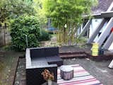 Before: the side yard was spacious, but the space was not well-utilized.  Photo 18 of 20 in Before & After: An Expanded Wedge-Shaped Abode Flaunts its Midcentury Roots