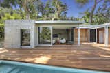 Outdoor, Decking, Trees, Large, Large, Back Yard, Hanging, Swimming, Concrete, and Wood The pool house has been designed by Taalman Architecture.

  Outdoor Trees Back Yard Concrete Decking Hanging Photos from A Thoughtfully Updated Hillside Home in L.A. Lists For $5.12M