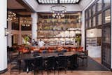 Studio Collective outfitted the double-height, soaring lobby space in the spirit of great European hotel bars.