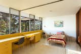 Midcentury modern Neutra home bedroom with built-in yellow desks