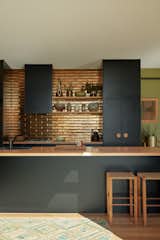 Designed to be energy efficient and to have a minimal impact on the environment, Fish Creek House by Archiblox was inspired by the principles of permaculture and the homeowners’ desire to be self-sufficient as they work towards minimizing their carbon footprint. The kitchen backsplash tiles are Perini tiles in jaca bronze, their metallic glaze reflecting the natural light.