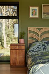 The main bedroom has a skylight positioned above the bed, connecting the space to the surrounding nature and flooding it with natural light.&nbsp;