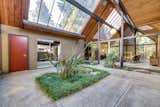 The double-gable atrium floods the home with natural light.  