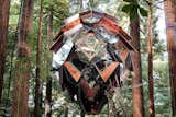 Designer and builder Dustin Feider started O2 Treehouse to inspire people to "reconsider how we can more harmlessly co-exist with nature," and the company now offers stays in the Pinecone Tree House on Airbnb. The structure is suspended in the forest and can be accessed via a steep wooden ladder and a trap door that unfolds from the top.