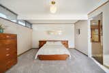 The bedrooms feature new&nbsp;carpeting and original, midcentury lighting.&nbsp;