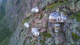 Skylodge Adventure Suites are luxury dwellings affixed to the mountainside in Peru's Sacred Valley, approximately nine miles north of Cusco. Visitors interested in staying at Skylodge must climb a quarter of a mile of protected trails and fly through the sky on zip lines.