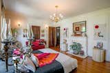 This room, like many in the mansion, features a chandelier and a fireplace. 