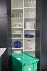 Floor-to-ceiling cabinets add ample storage space and also help hide any mess.