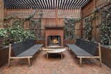 An expansive outdoor terrace—especially one with a wood-burning fireplace is a rare find in a downtown Manhattan full-service building.