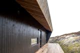 The ore pine roof prevents rain from dribbling down the cabin's "neck," where the main entrance is.