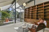 The room has two walls of built-in bookshelves and would make a lovely light-filled library.