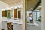 As you enter the master suite, a bathroom lies to the left. 