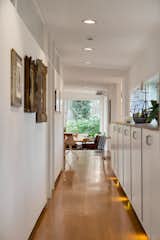 A bright hallway lined with storage leads to the kitchen.&nbsp;