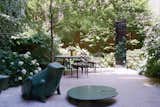 The garden, designed by Harrison Green, has a toad chair and a lily pad by François-Xavier Lalanne. 
