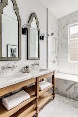 The guest bath features two sinks and lots of marble.&nbsp;