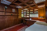 The four bedrooms in the house also have walls paneled in Philippine mahogany, ceilings of concrete blocks, and built-in furniture.