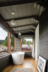 The porch now serves as a master bath with a deep soaking tub.